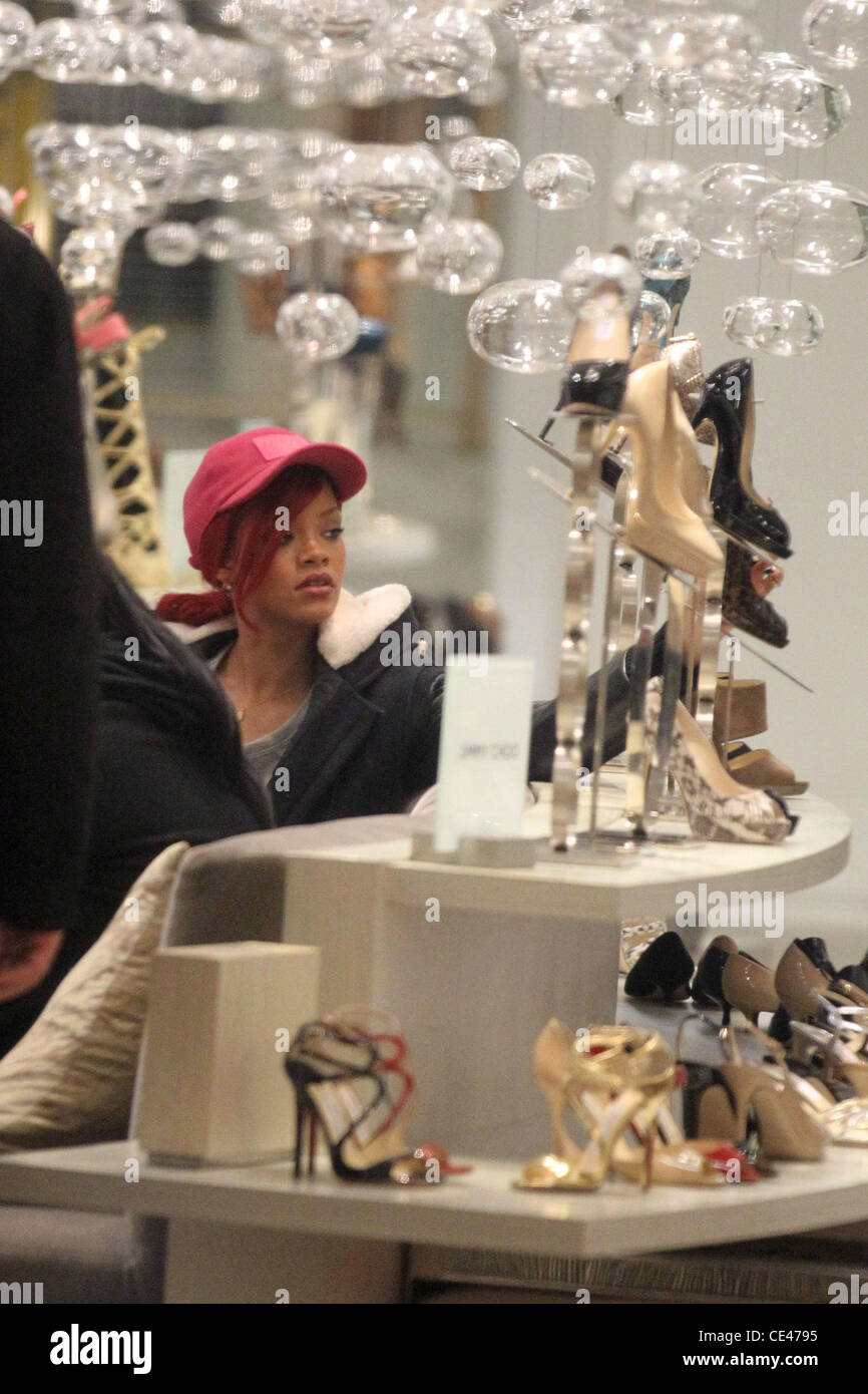 Rhianna trying on shoes while out shopping at the Sax Fifth Avenue ...