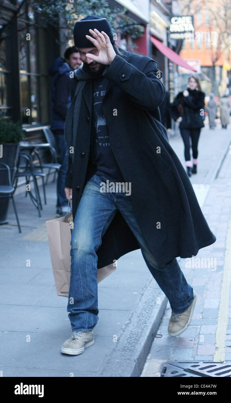 Keanu Reeves is seen shopping at Kiehl's and avoiding the paparazzi while in Covent Garden. London, England - 09.01.11 Stock Photo