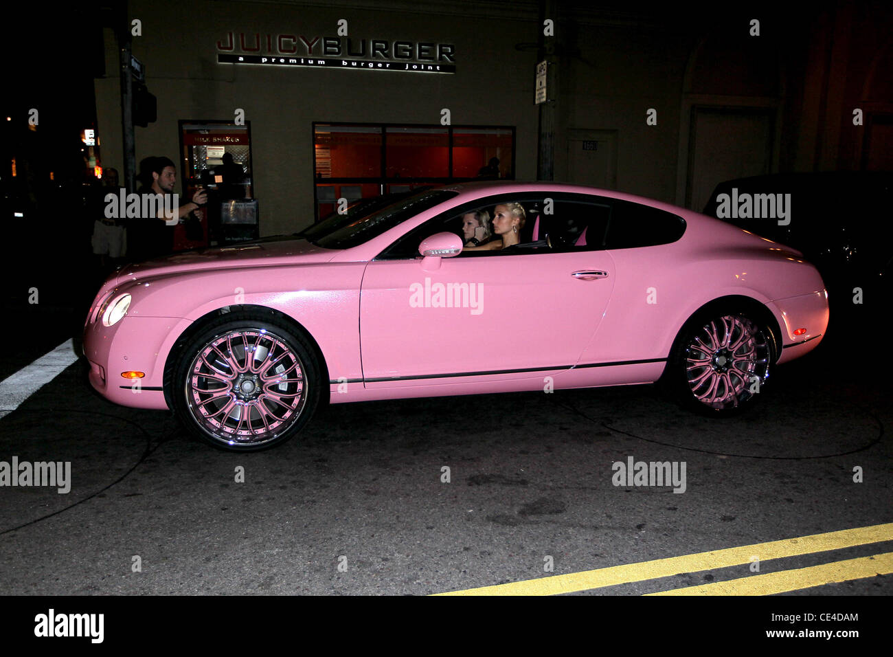 Paris Hilton driving in her pink Bentley to have dinner with a friend
