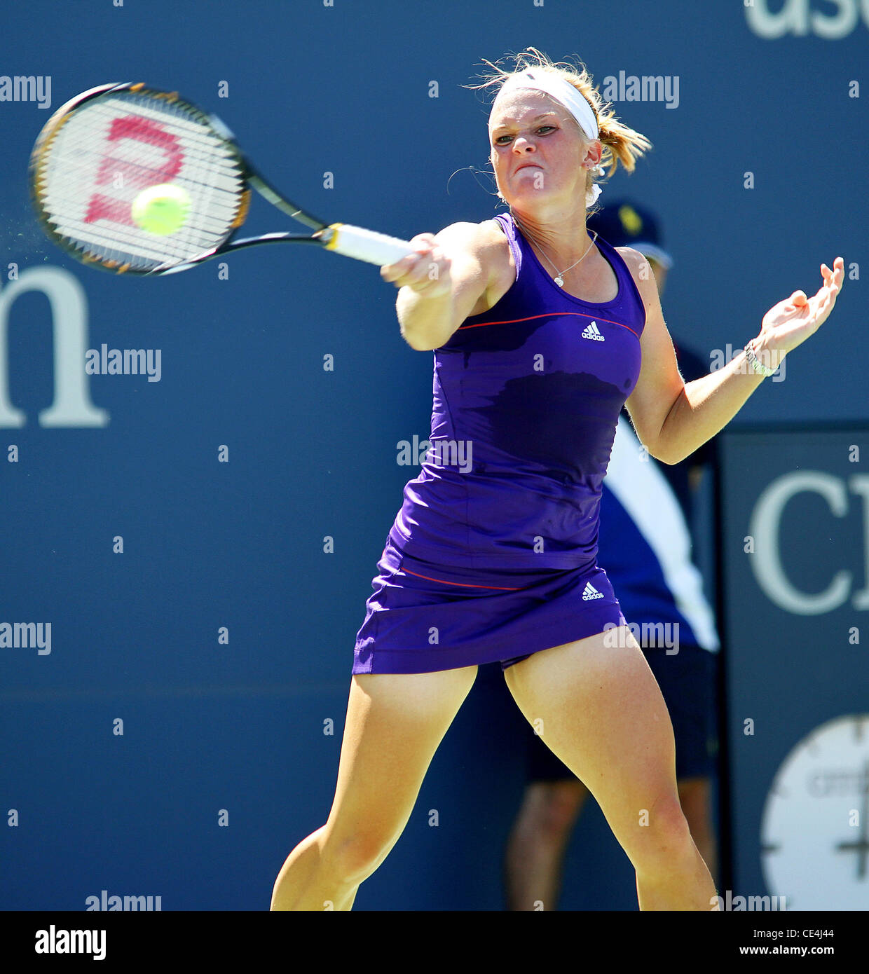 Melanie Oudin of the United States competes against Olga Savchuk of the Ukraine during her first round women's single match on day one of the 2010 U.S. Open at the USTA Billie Jean King National Tennis Center.  Oudin beat Savchuck with a score of 6-3, 6-0 Stock Photo
