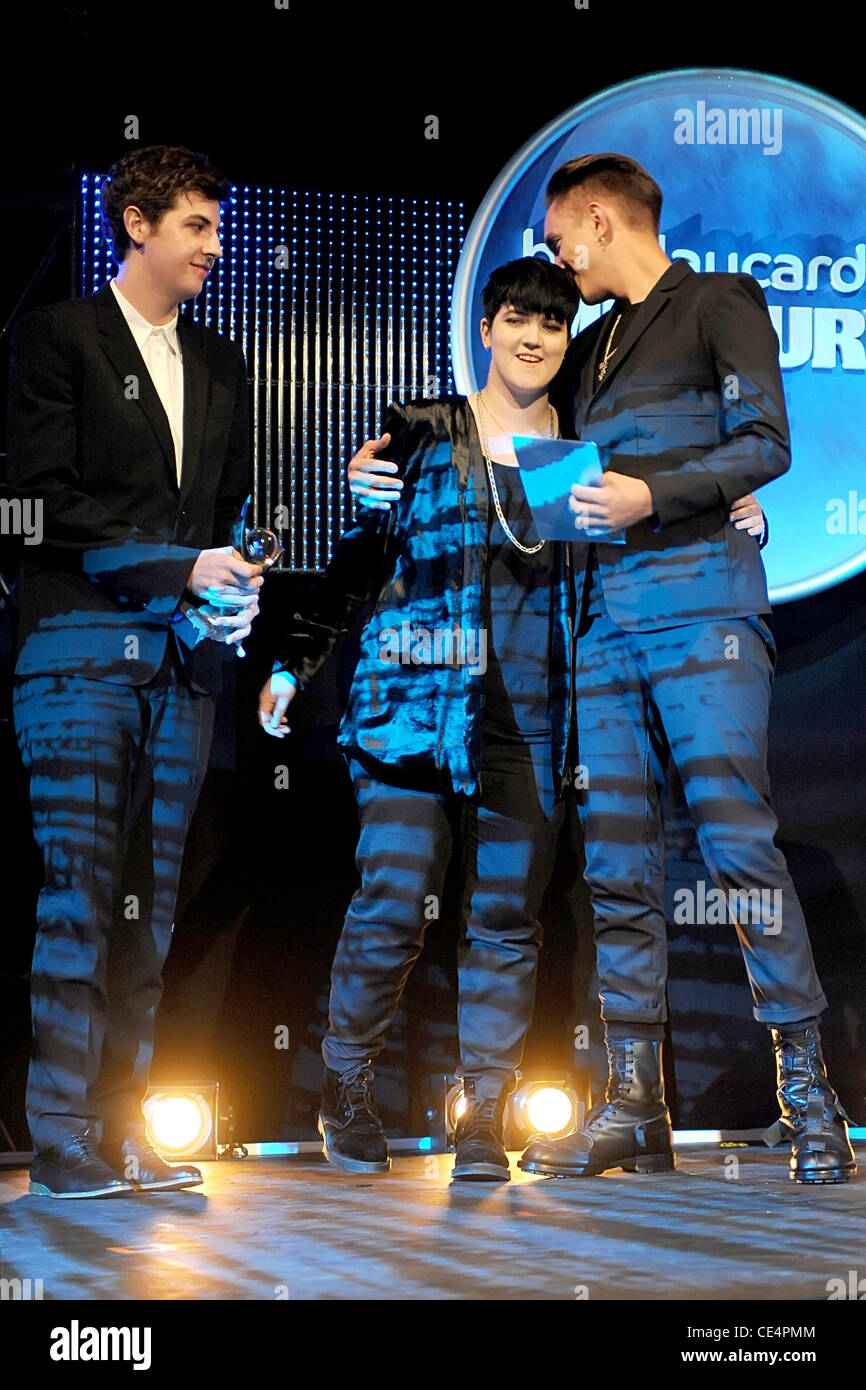 Jamie Smith, Romy Madley Croft and Oliver Sim of The xx accepting their win  for top