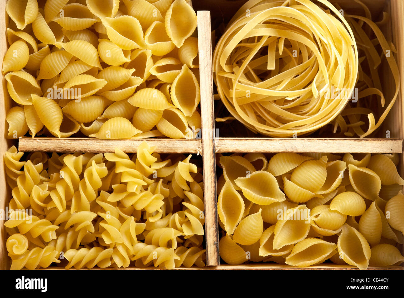 Set of four varieties of pasta in a wooden box Stock Photo