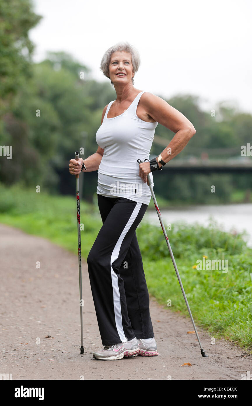 Old woman walking nordic hi-res stock photography and images - Alamy