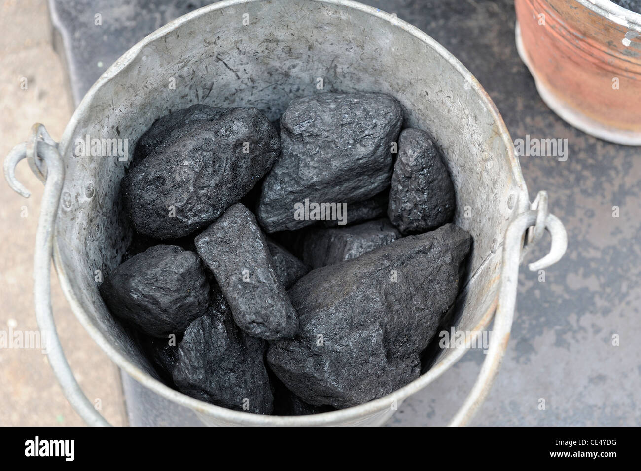 lumps of coal in a metal bucket england uk Stock Photo Alamy