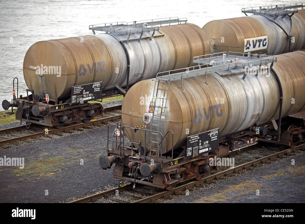 Railway tanker wagons beside river Rhine Germany Stock Photo