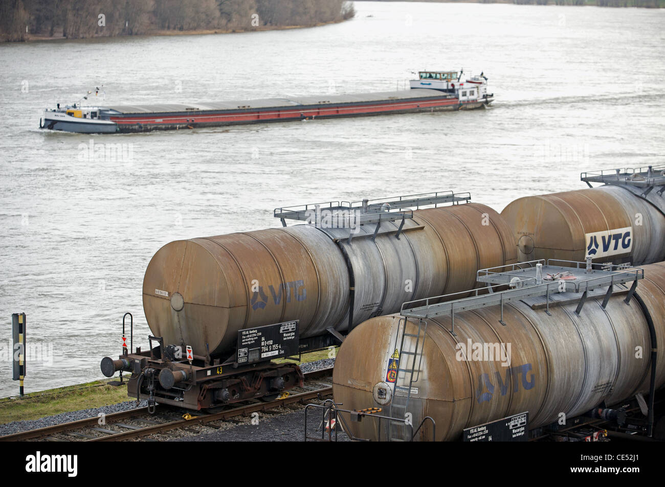 Railway tankers wagons beside river Rhine Germany Stock Photo