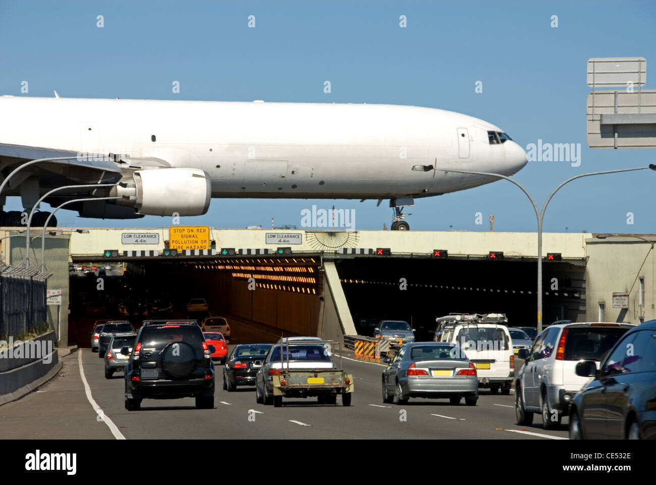 An aircraft travelling above the M5 road tunnel at Kingsford-Smith airport, Sydney, New South Wales, Australia Stock Photo