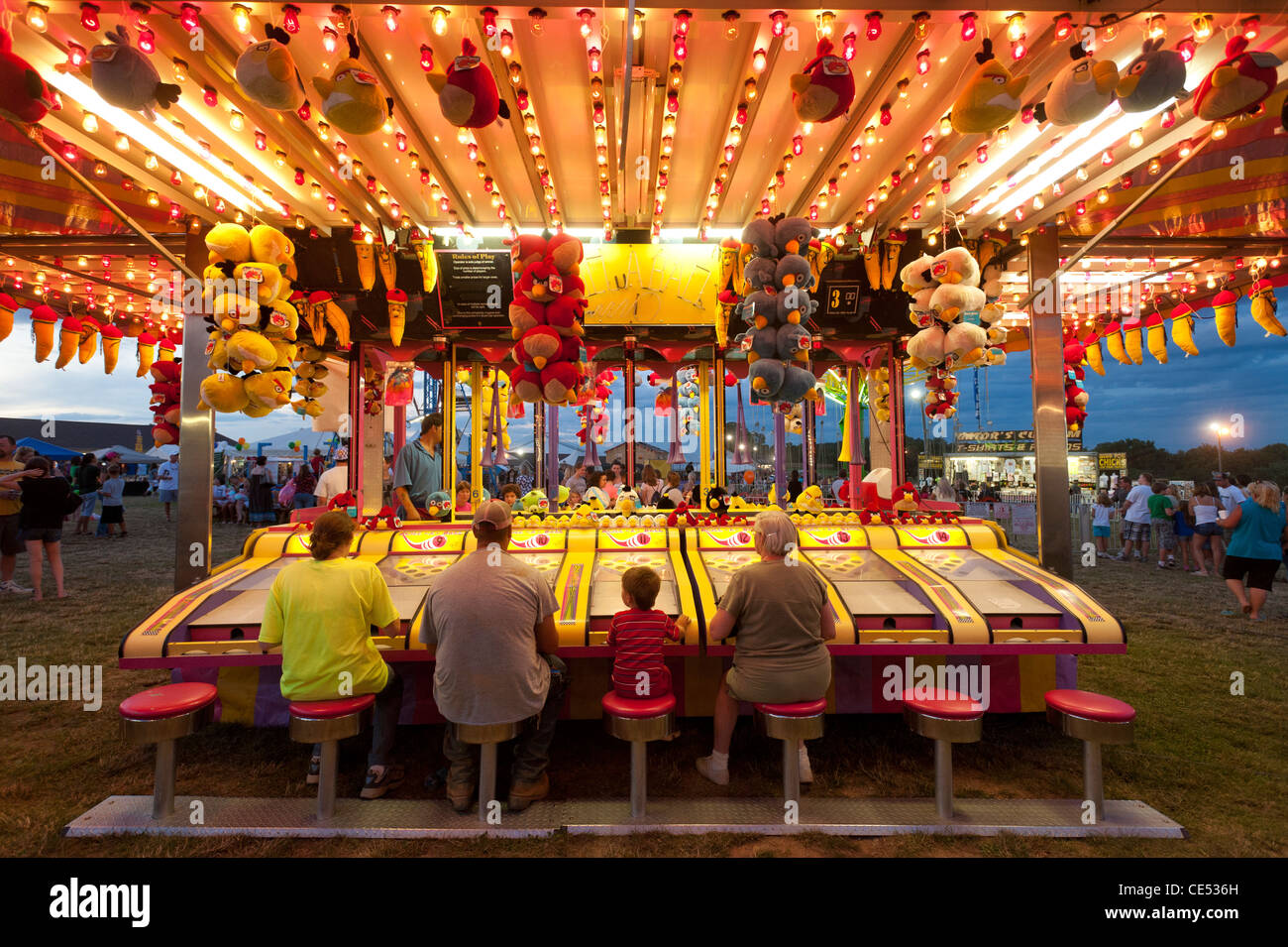 People playing a game at the carnival of the Mason Dixon Fair Stock