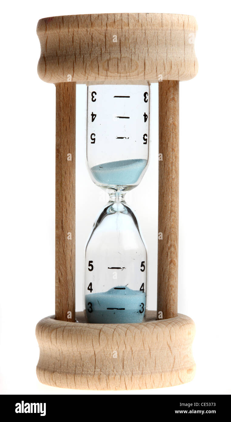 Hourglass, analog timing through slowly running sand. Stock Photo