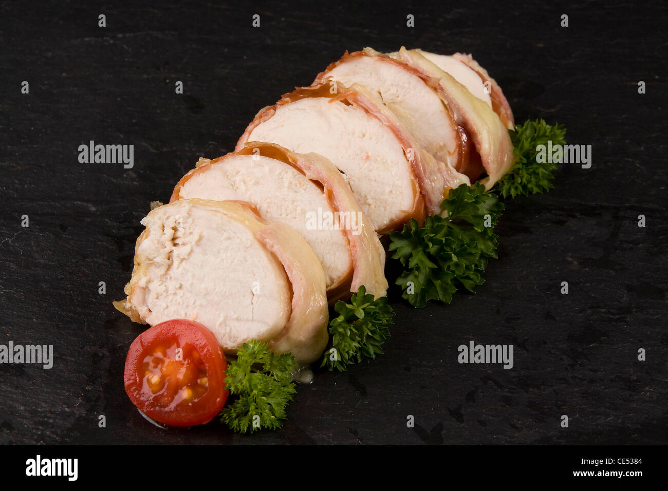 chicken wrapped in ham and cheese Stock Photo Alamy