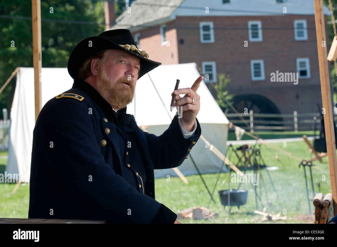 Civil War reenactor dressed in historic garb in Civil War encampment at Union Mills MD Stock Photo