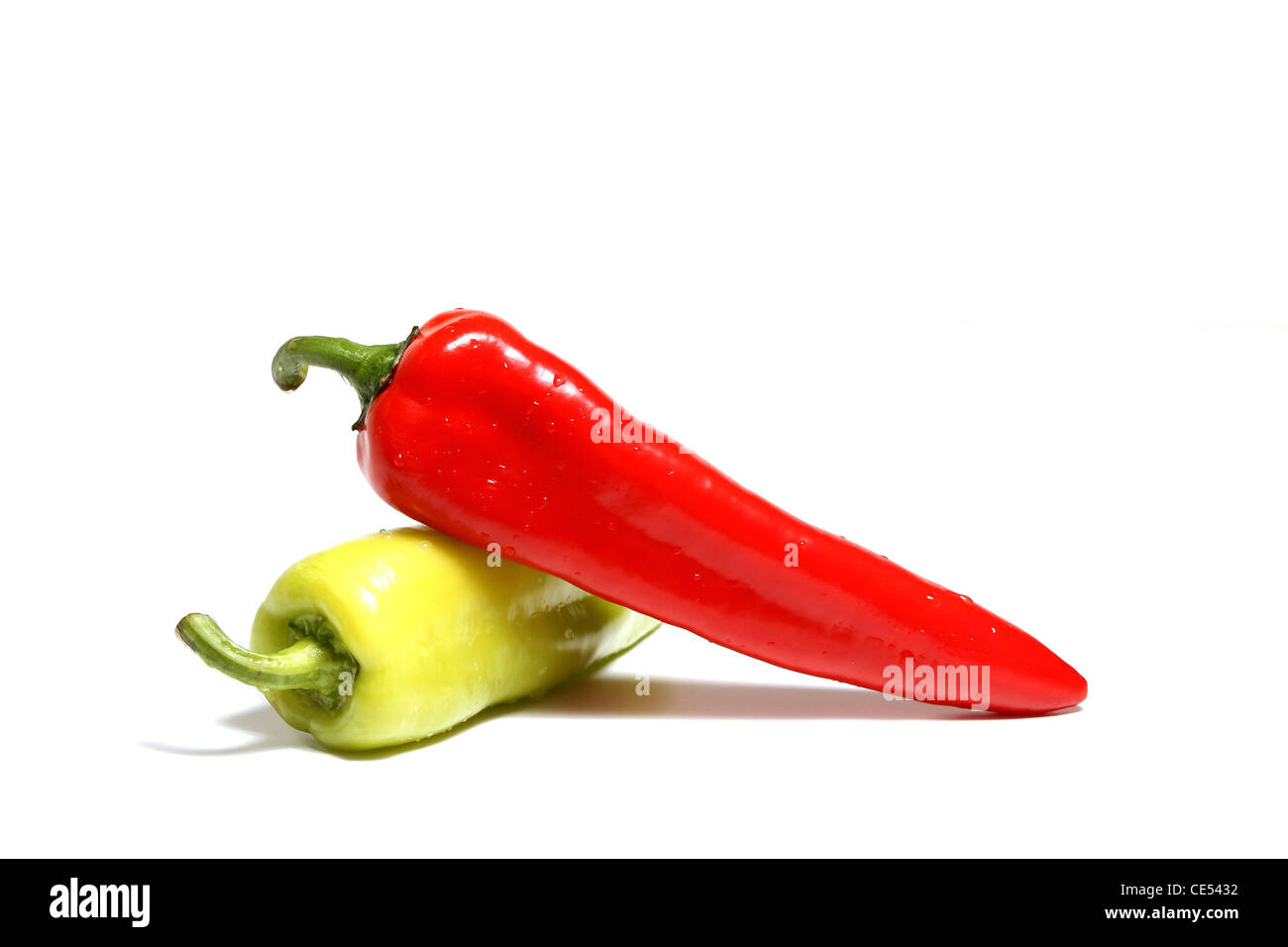 Red and green peppers isolated over white background Stock Photo - Alamy