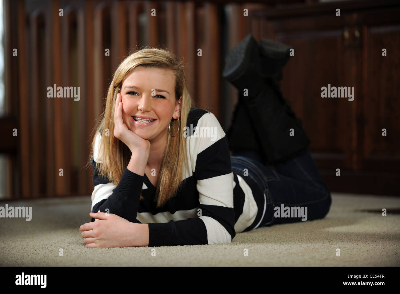 Teenager girl laying on floor hi-res stock photography and images - Alamy