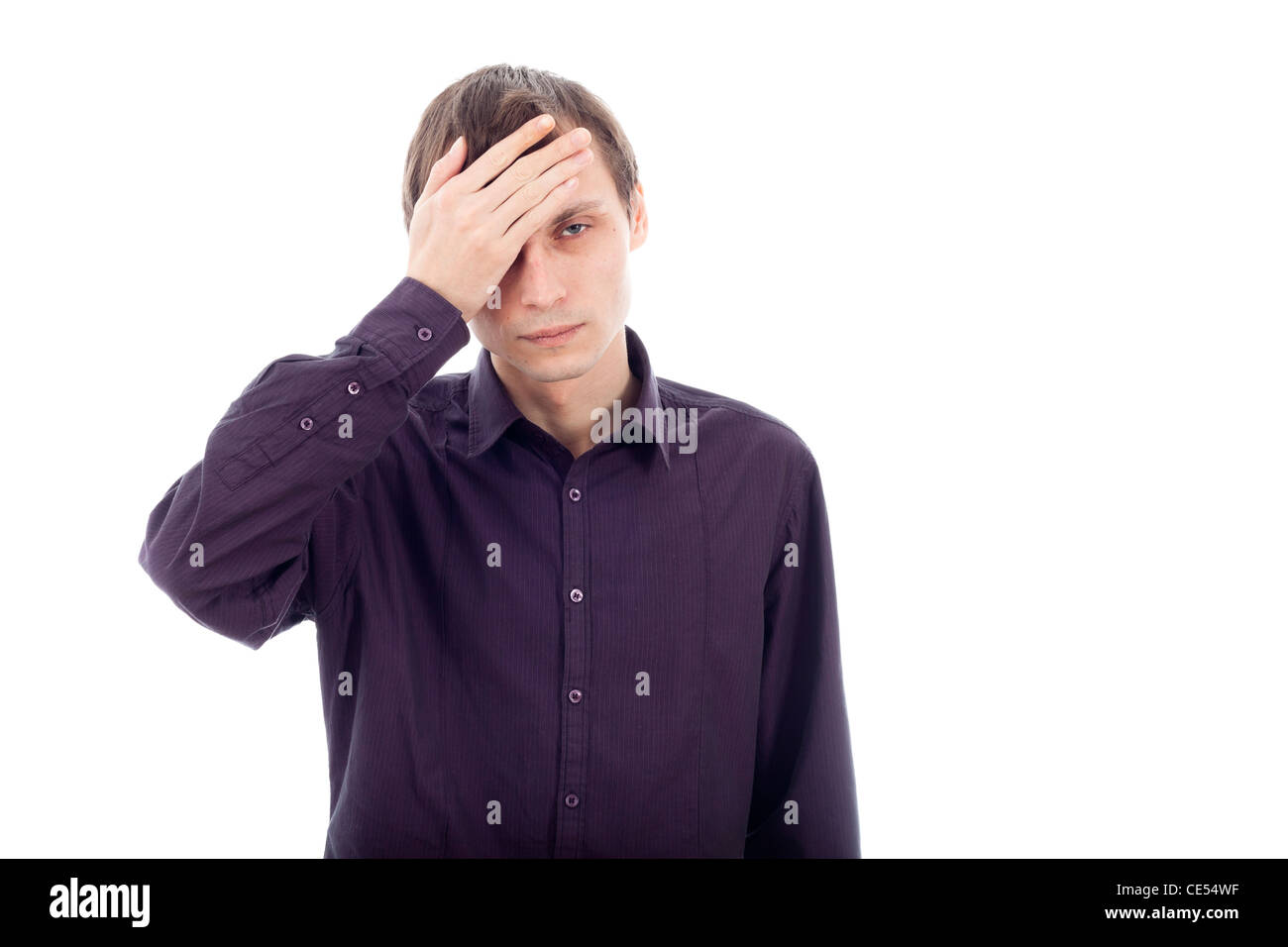 Portrait of man with headache, touching his head. Isolated on white background. Stock Photo