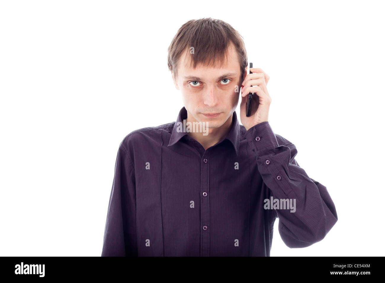 Serious weirdo man on the phone, isolated on white background. Stock Photo
