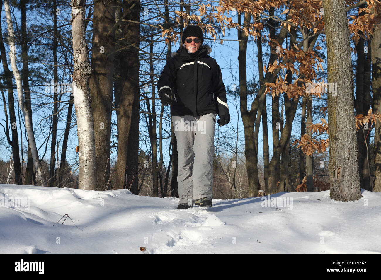 Woman walking snow facing hi-res stock photography and images - Alamy