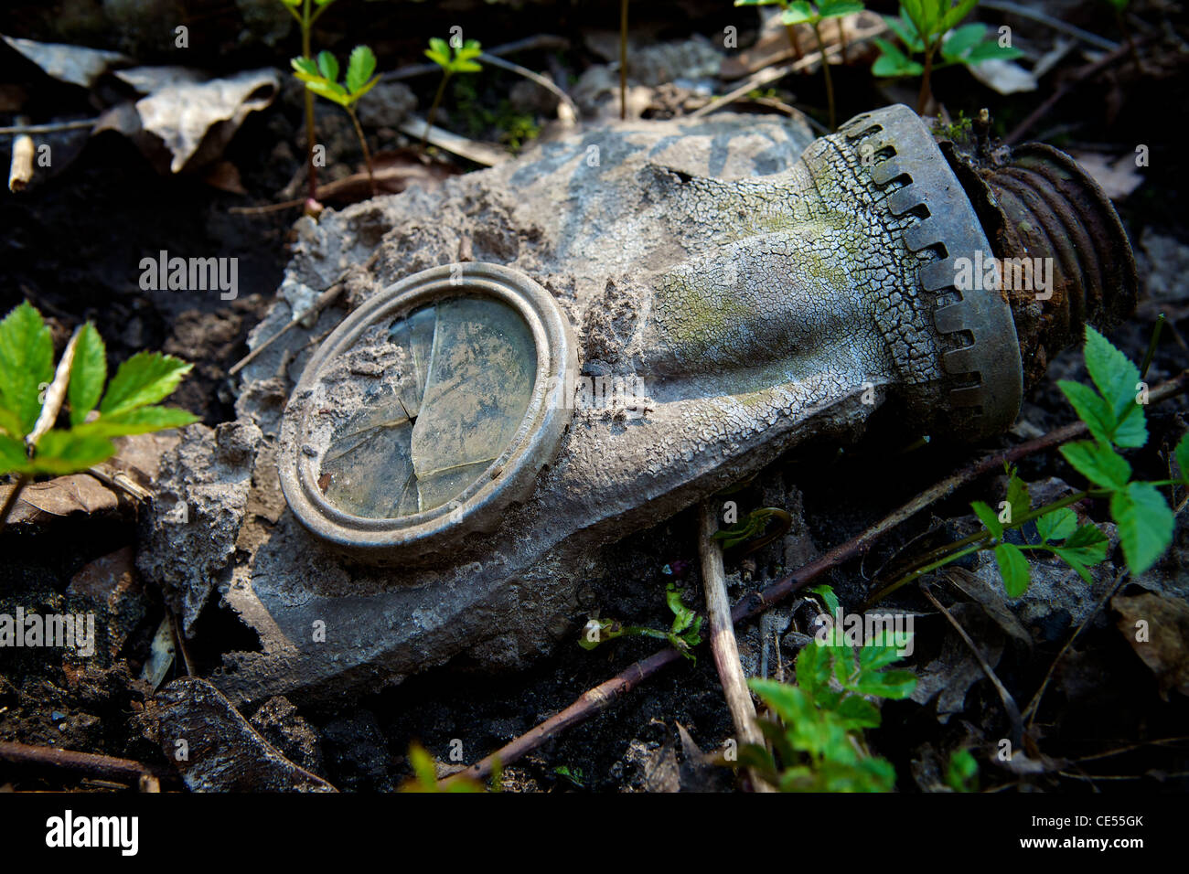 Gas mask on the ground and the grass background Stock Photo