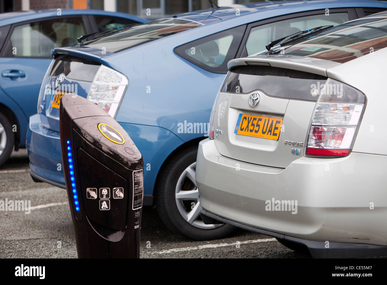 Prius hybrid cars and an electric car recharging station Stock Photo
