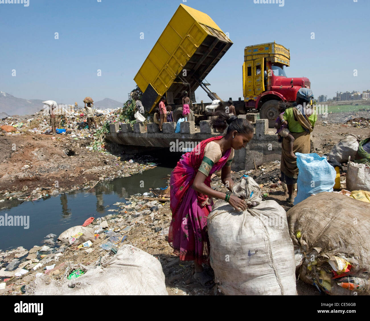 A family of rag pickers pictured on a dump in Virar situated on the