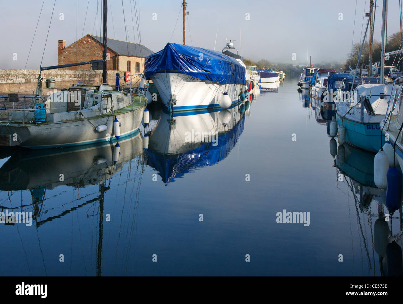 Boats moored in harbour off the Gloucester and Sharpness canal at Sharpness Stock Photo