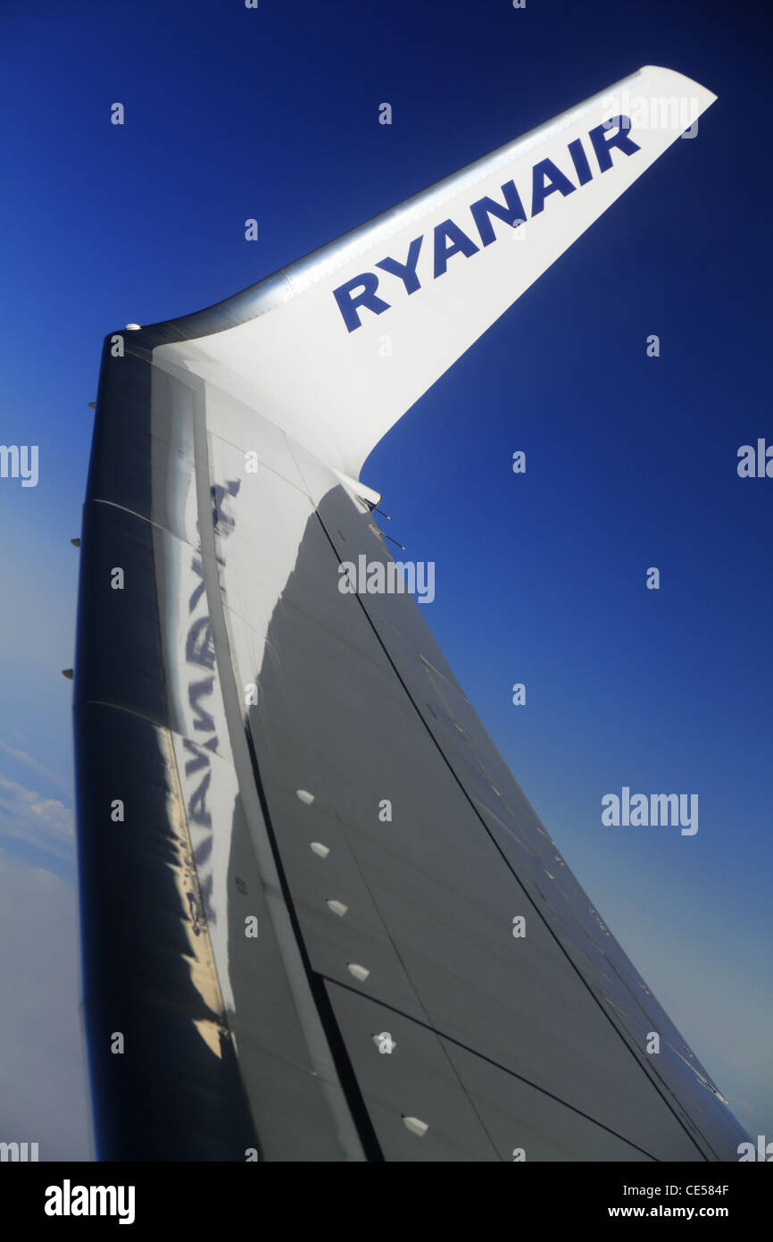 The wing tip logo of budget airline Ryanair Boeing 737 800 aircraft airplane plane in flight. Stock Photo