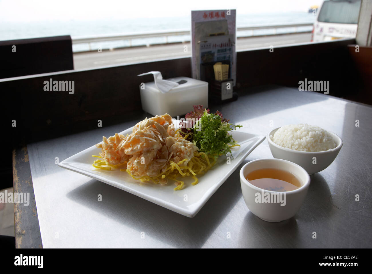 wok fried prawns meal in a seafront restaurant kennedy town hong kong