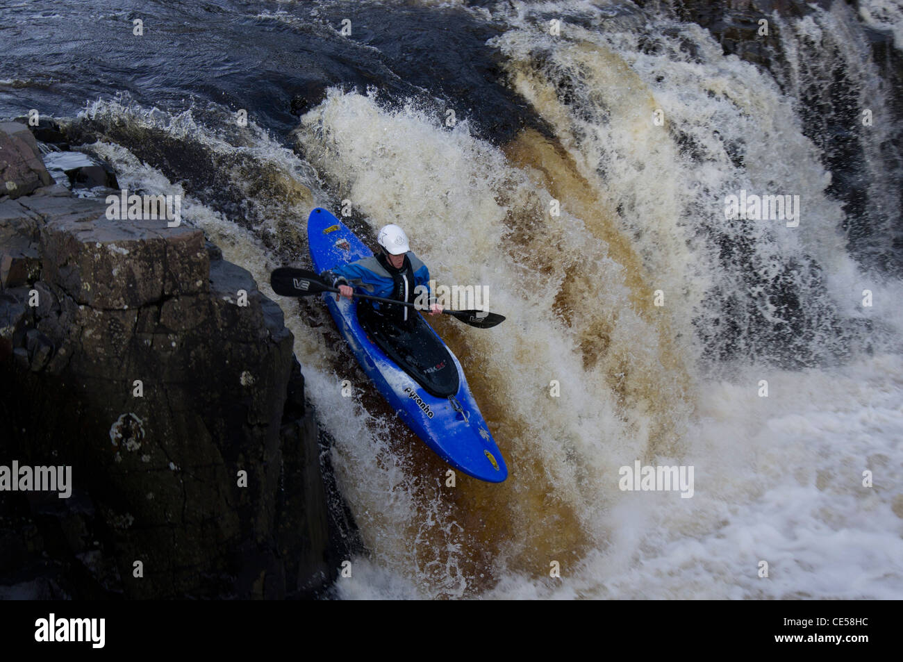 Kayaker on a waterfall in Teesdale, England Stock Photo