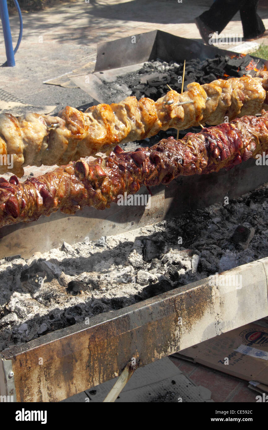 Roasting Kokoretsi, dish consisting mainly of lamb or goat intestines