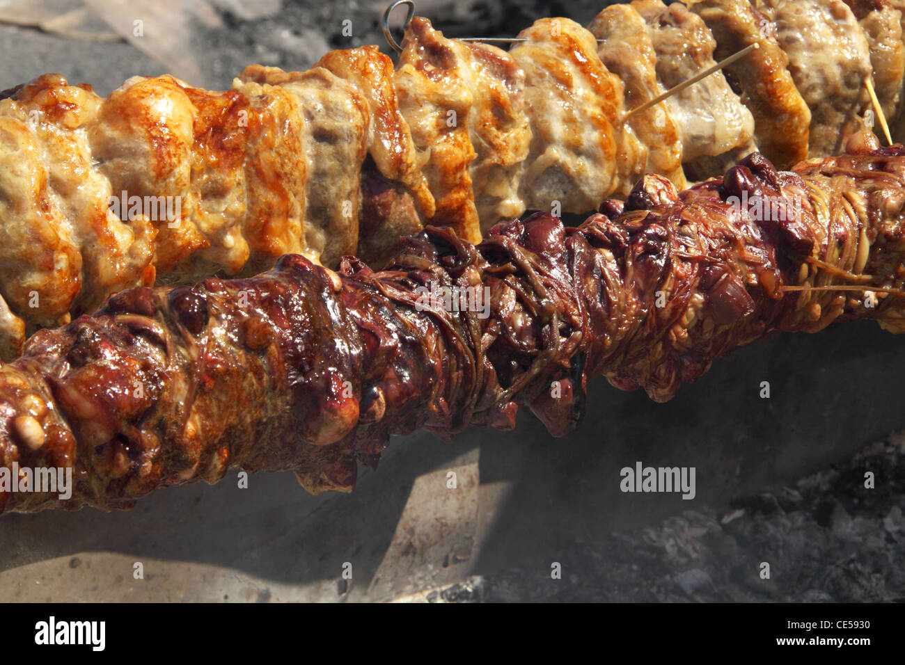 Roasting Kokoretsi, dish consisting mainly of lamb or goat intestines