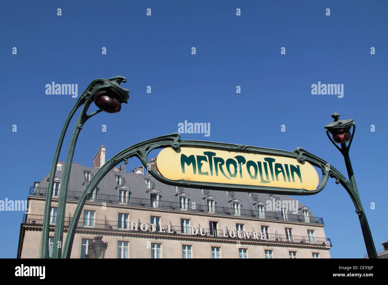 Sign of Metro station near Louvre museum and view of the Hotel du Louvre, Paris, France Stock Photo
