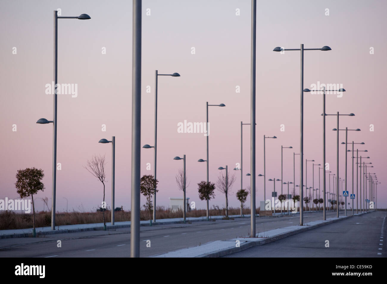 Rows of redundant street lighting, near Seseña, in the province of Toledo, near Madrid Spain. Photo:Jeff Gilbert. Stock Photo