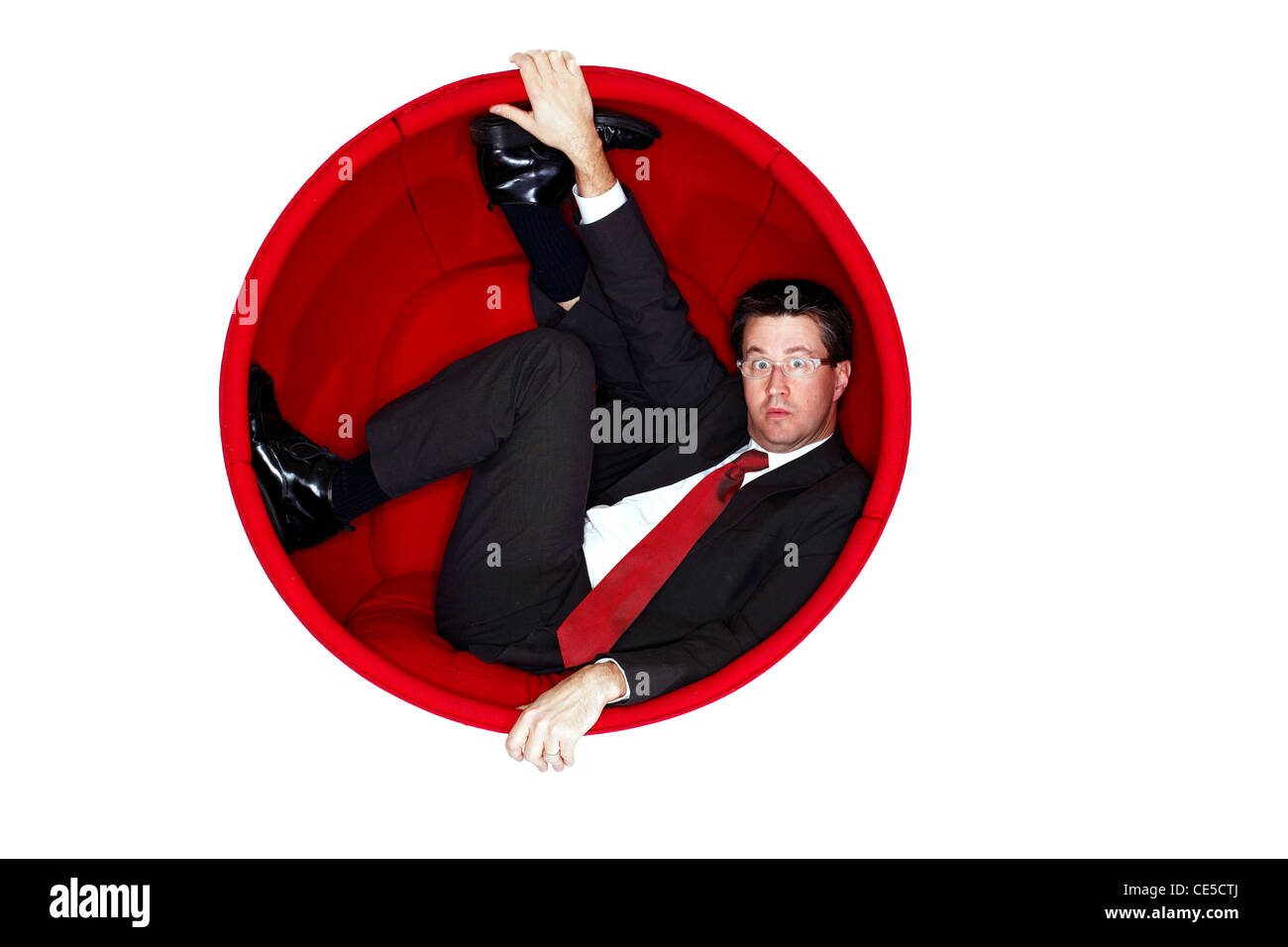 Portrait of a man in a retro ball chair Stock Photo