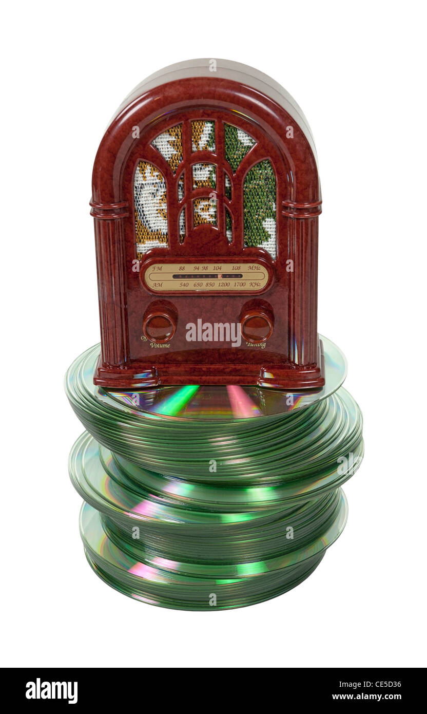 Radio shows on disk shown by an antique radio on a stack of disks Stock Photo