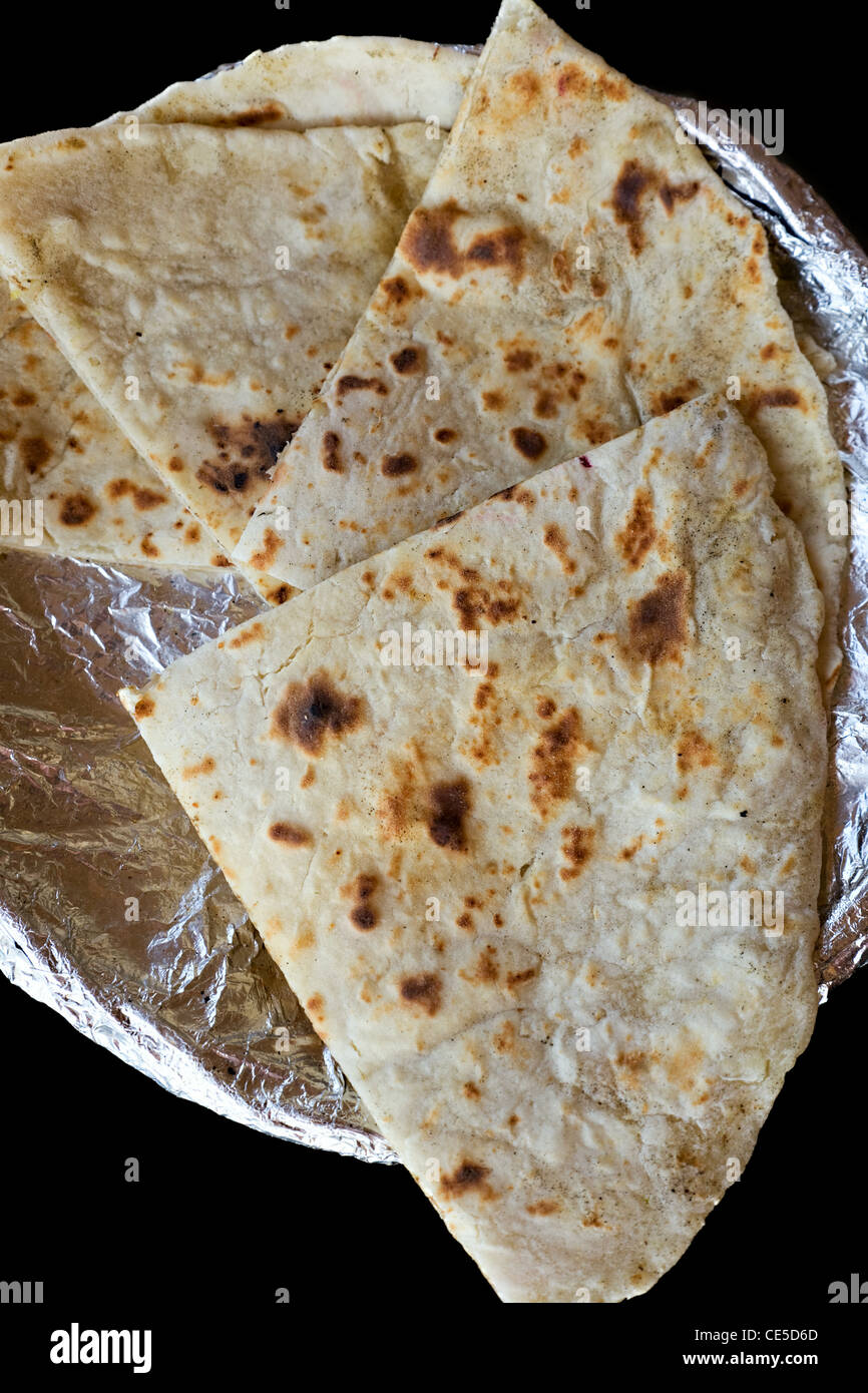 fried bread of india - cheese and Garlic Naan Indian Flatbread Stock Photo