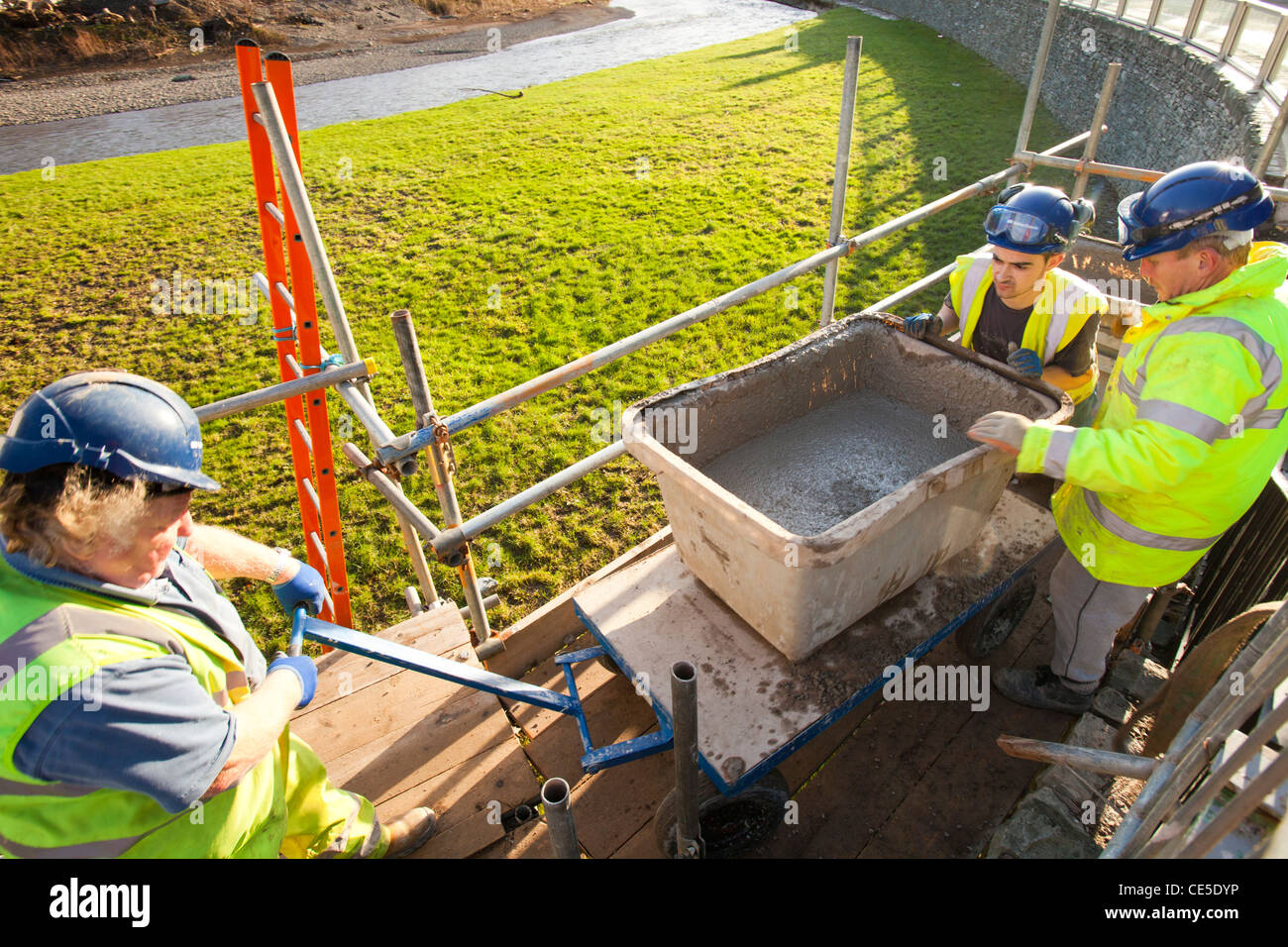 Building flood defences in Keswick after the disastrous 2009 floods. Stock Photo