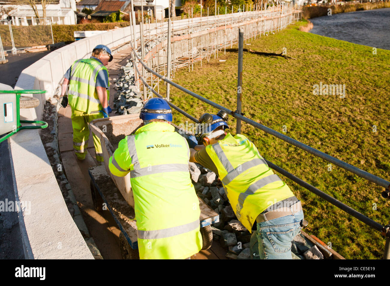 Building flood defences in Keswick after the disastrous 2009 floods. Stock Photo