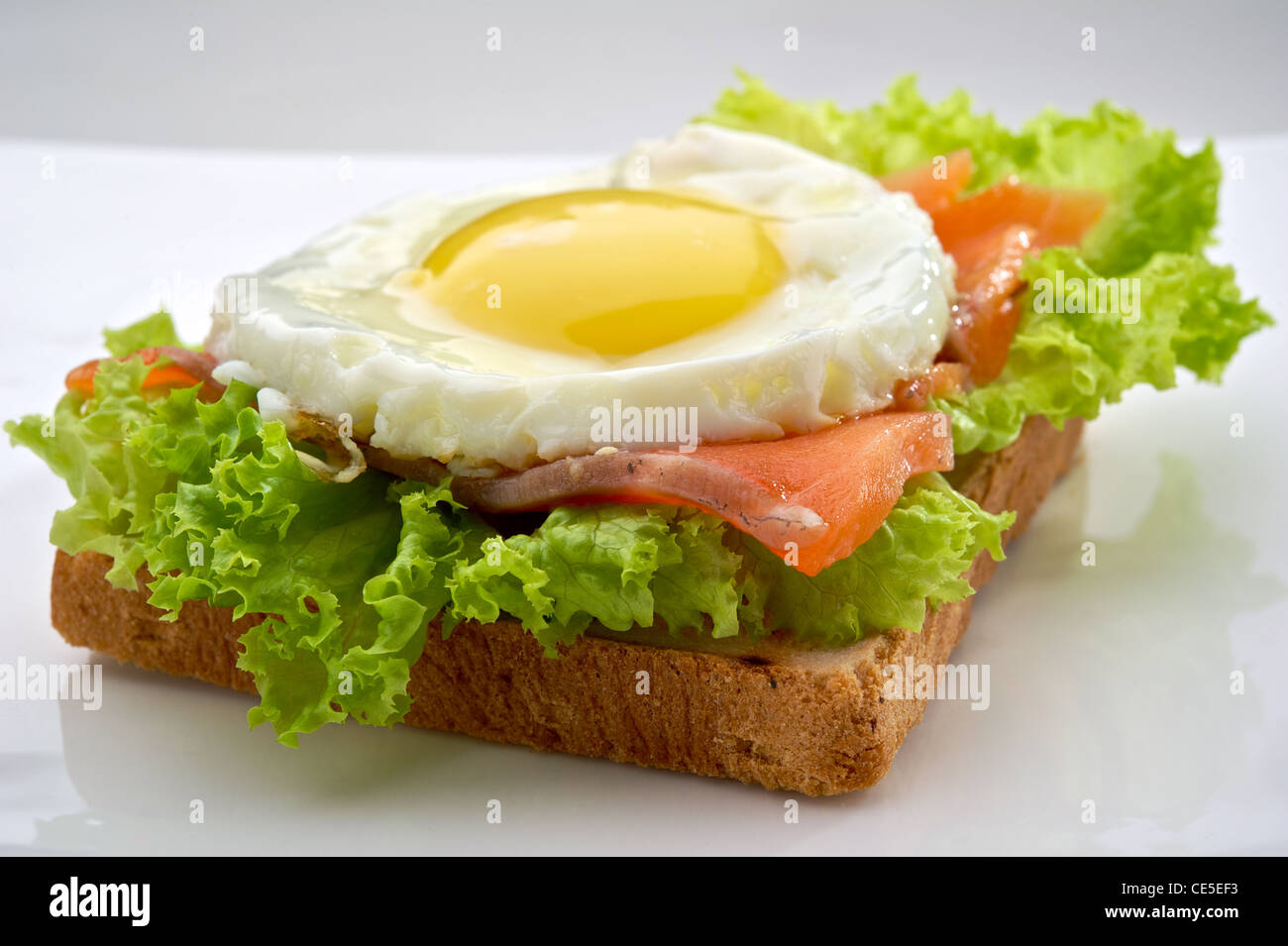 Fish breakfast with scrambled eggs and smoked salmon on toast, served