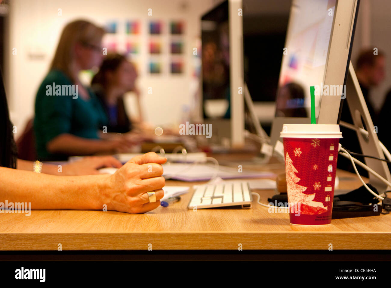 GRAPHIC DESIGN STUDIO WITH COMPUTERS AND DESIGNERS Stock Photo