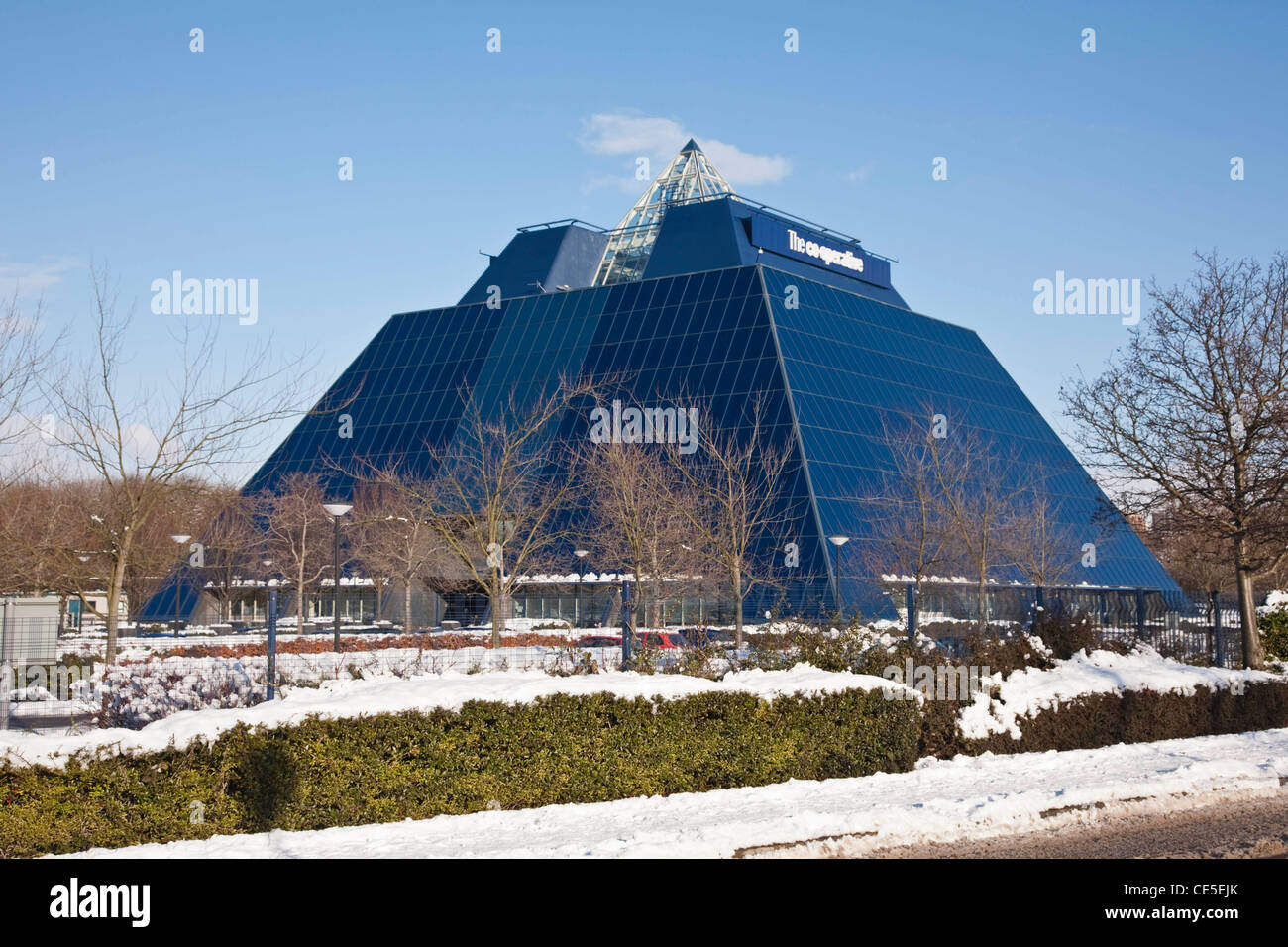Stockport's Co-operative Pyramid in the snow on a sunny day Stock Photo