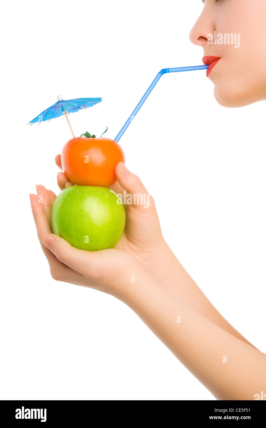 Woman's hand holding cocktail with straw and umbrella Stock Photo - Alamy