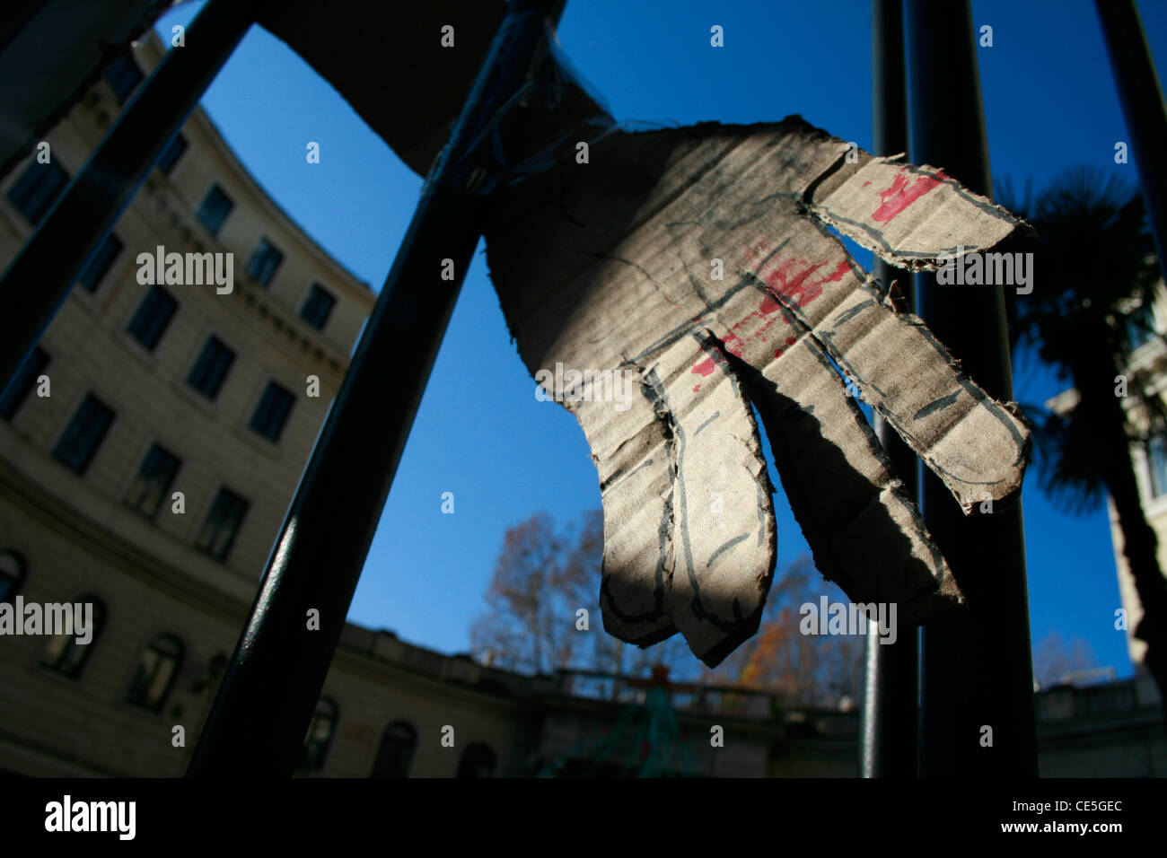 cardboard hand cutout by university college gate in rome italy Stock