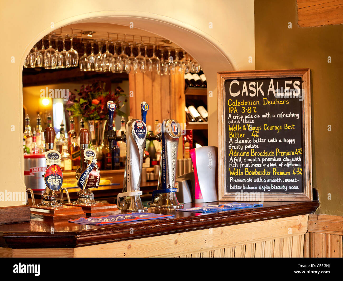 bar in a pub showing beers and pump handles Stock Photo