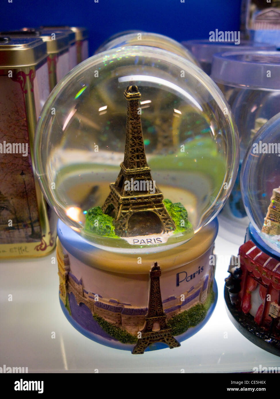 Eiffel Tower souvenir / gift snow dome, for sale in the tourist gift shop in Paris. France Stock Photo