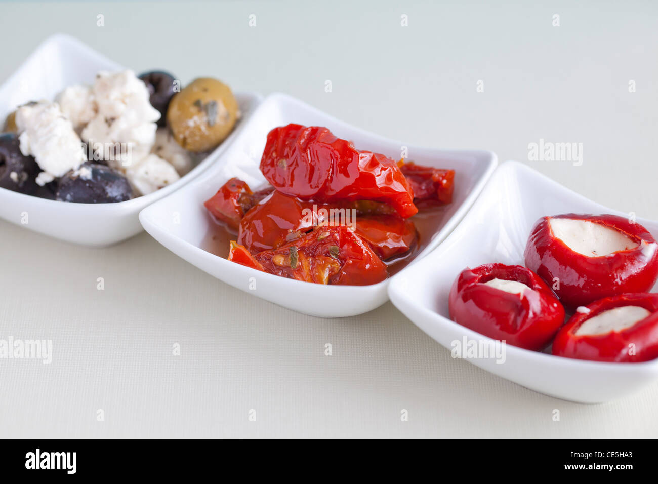 Mezze with olives, feta cheese, stuffed peppers & sun dried tomatoes Stock Photo