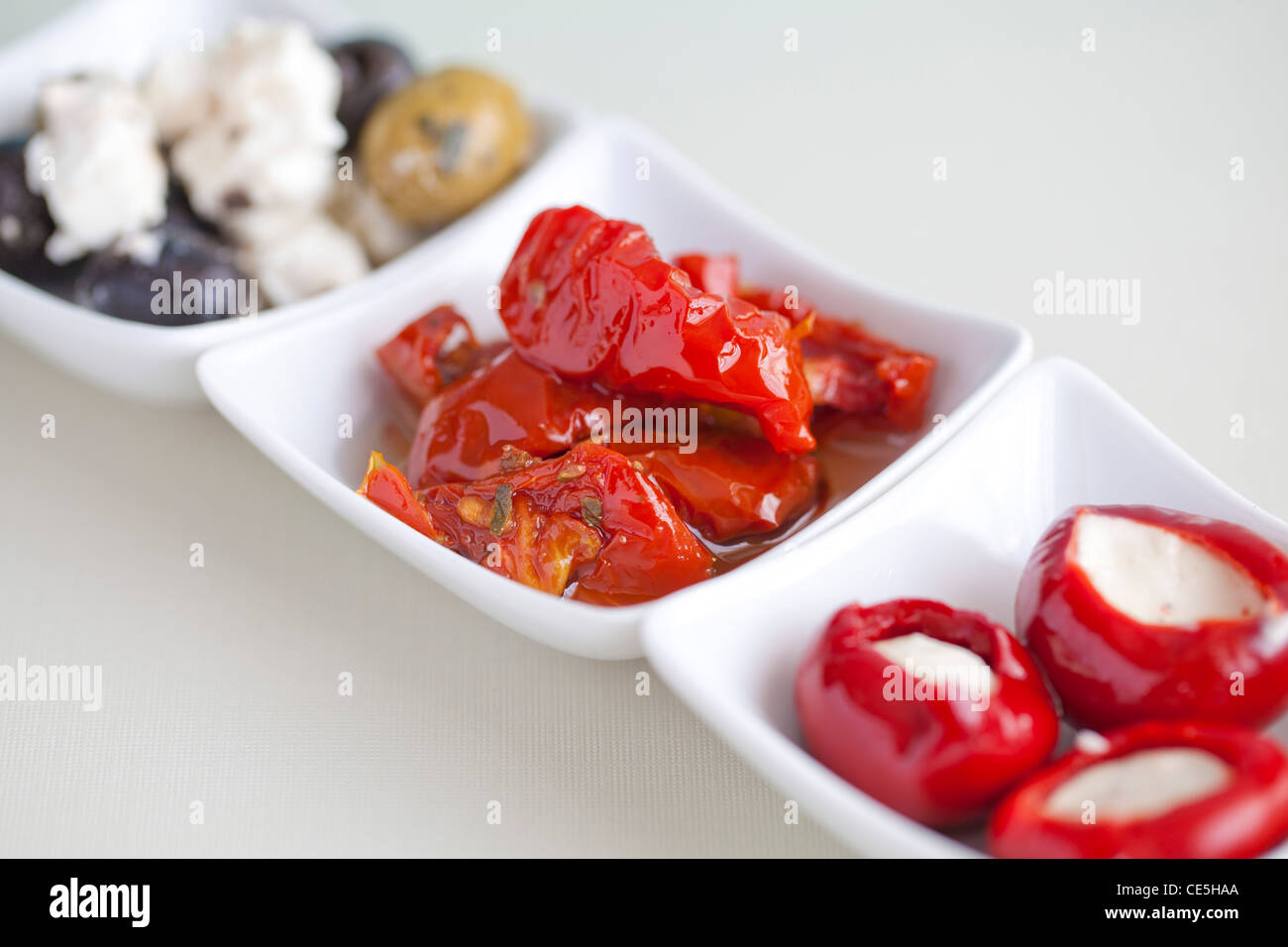 Mezze with olives, feta cheese, stuffed peppers & sun dried tomatoes Stock Photo