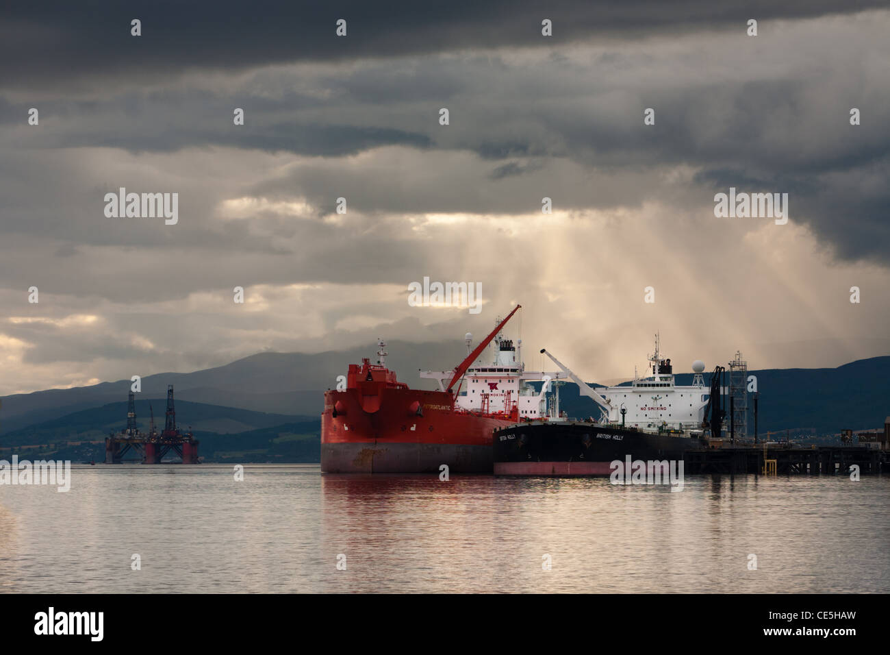 Oil Tankers and brooding sky on the Cromarty Firth, Ross & Cromarty, Scotland Stock Photo