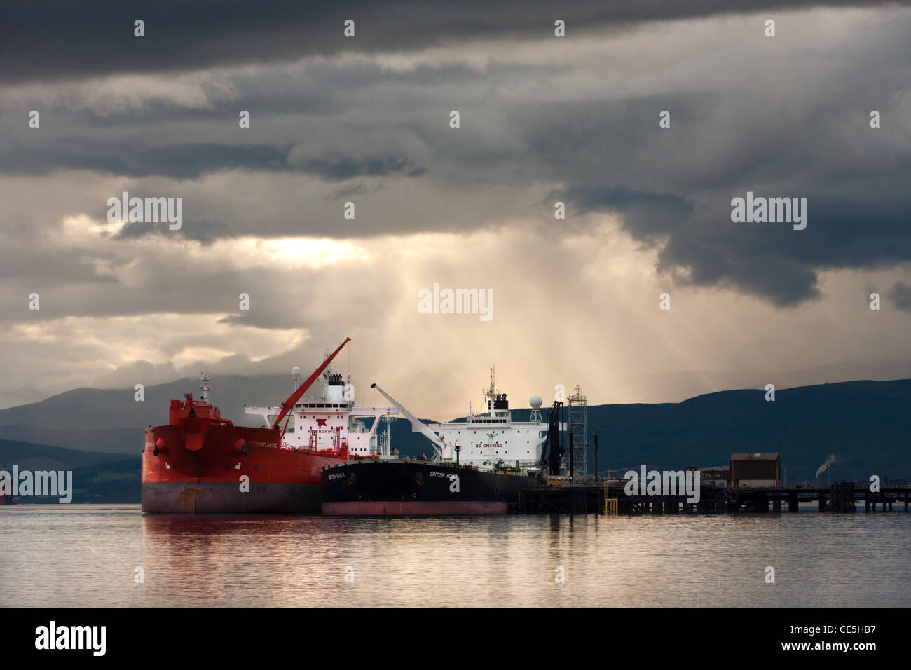 Oil Tankers and brooding sky on the Cromarty Firth, Ross & Cromarty, Scotland Stock Photo