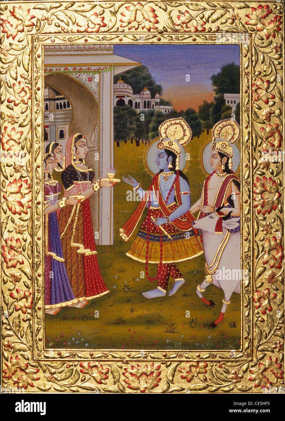 Radha Krishna with cow miniature painting on paper with gold emboss border mount Stock Photo