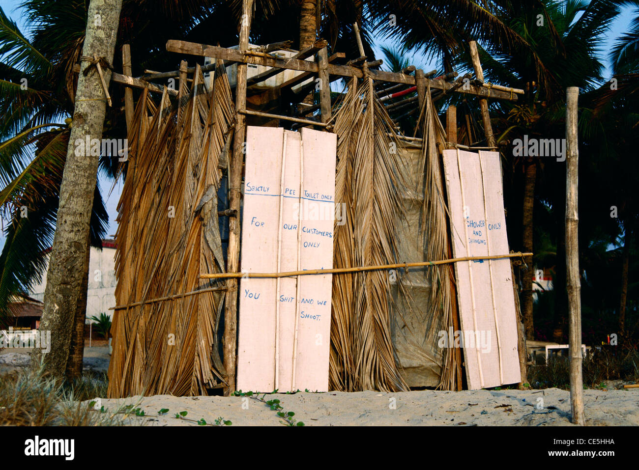 Public toilet made with palm tree leaves on beach ; Goa ; India Stock Photo