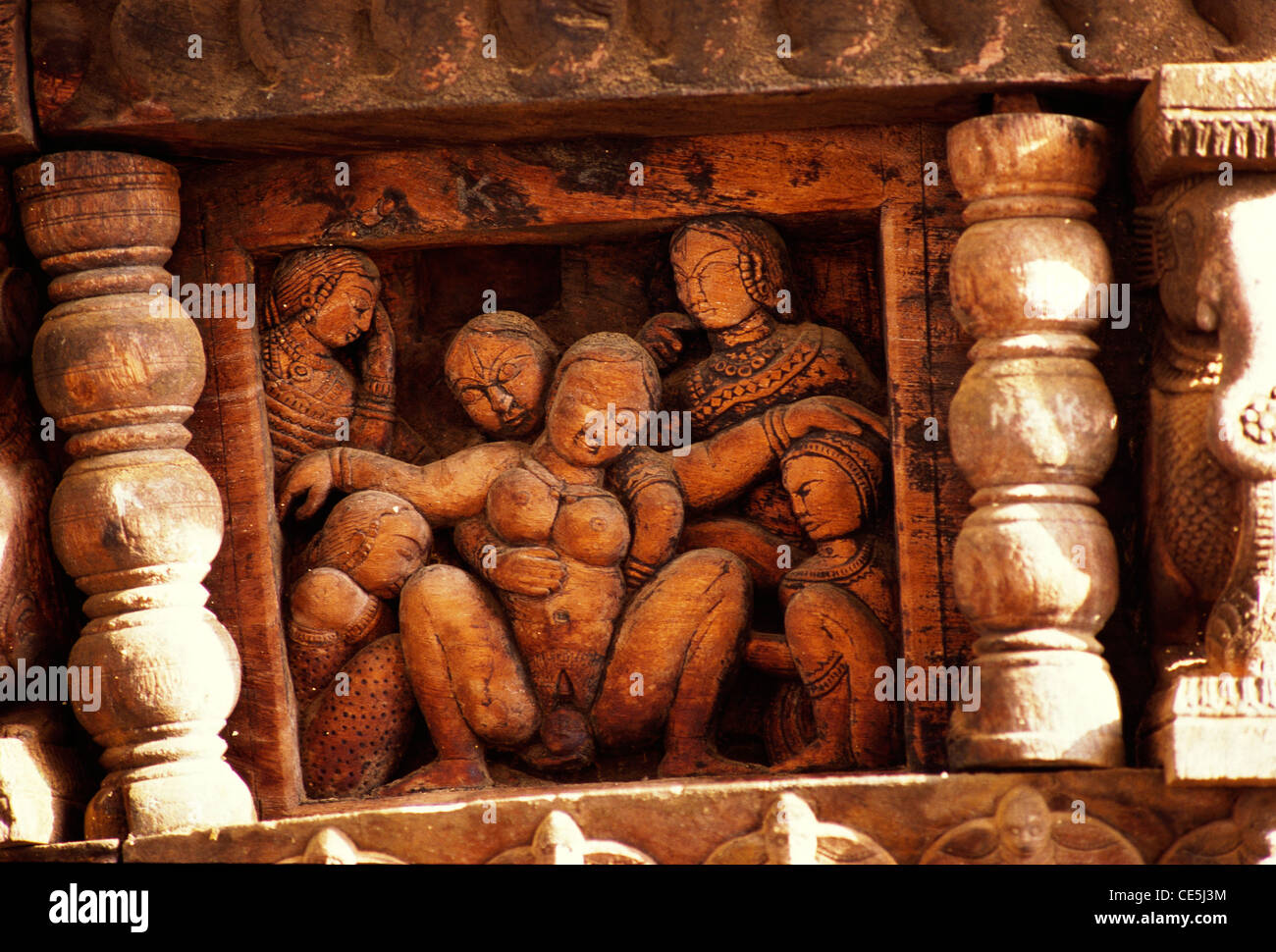 maa 68824 - Child birth wood carving exhibited in University Folklore Museum at Manasa Gangotri Mysore Karnataka India Stock Photo